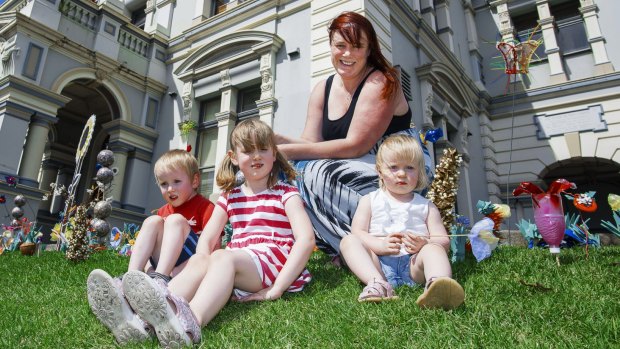 Kate Walsh with her kids Quinn 5, Aidan 4 and Niamh 1 at Leichhardt Town Hall. 