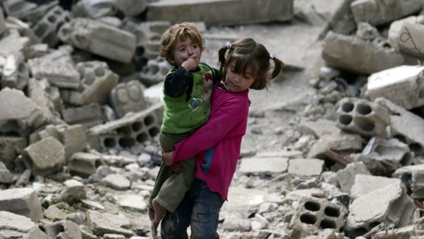 Syrians battle to survive in the crushed districts of Damascus on Thursday.