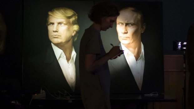 Portraits of the president-elect, Donald Trump, and President Vladimir  Putin of Russia in Moscow.