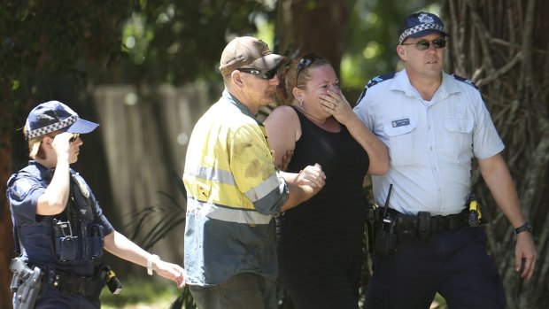 A woman at the scene in Manoora, Cairns, where the mutliple stabbing occured.