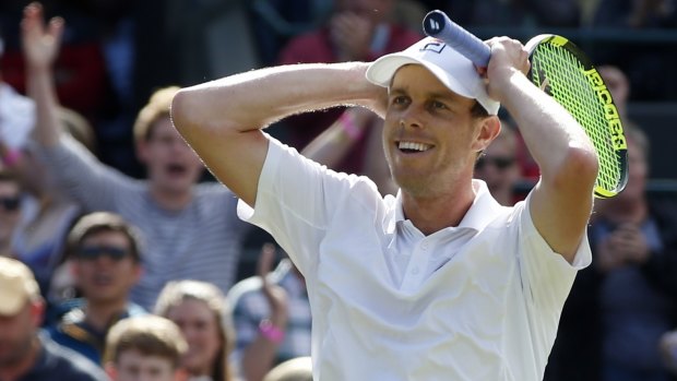 Sam Querrey of the US celebrates after beating Djokovic.