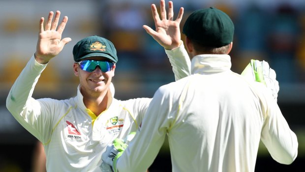 Wrapped up: Steve Smith celebrates the final wicket falling for England' with Tim Paine