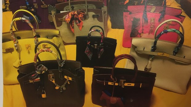 Some of the hundreds of designer handbags seized from Christine Jia Xin Lee's unit in Rhodes. 