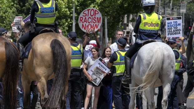 Anti-racism protesters during simultaneous rallies outside State Parliament.