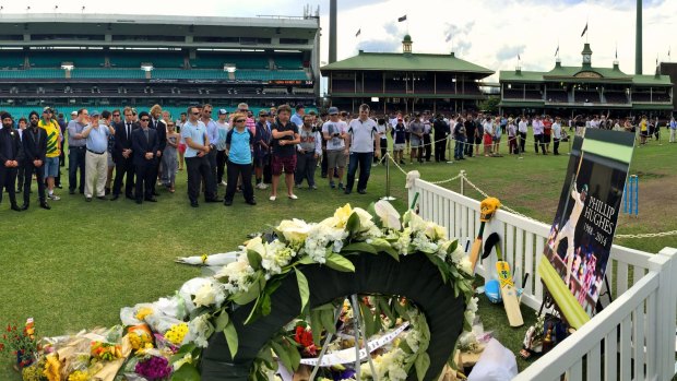 Tribute: Fans pay their respects to Phillip Hughes at the SCG on Wednesday.