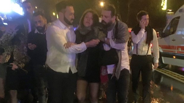 People leaving the nightclub, the scene of an attack in Istanbul, early Sunday.
