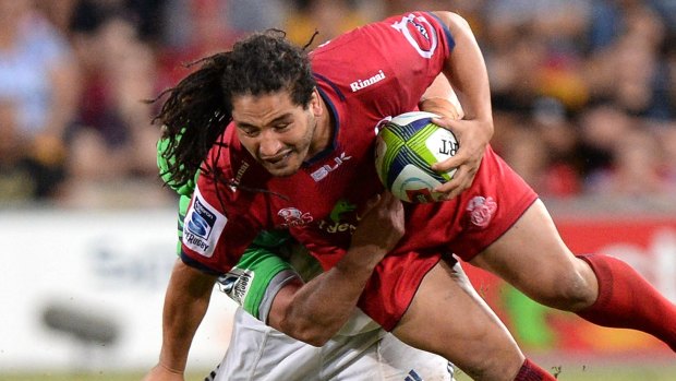 Saia Fainga'a of the Reds takes on the defence during the round seven Super Rugby match between the Reds and the Highlanders in April.