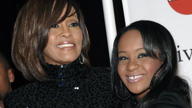 A big burden: Whitney Houston, left, and daughter Bobbi Kristina Brown.