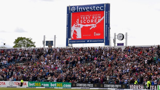 The giant screen at Headingley announces Cook's record.