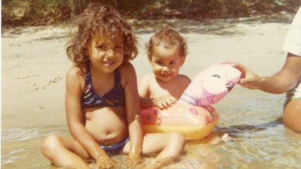 Miriam Corowa; (top, at right) as a one-year-old with her older sister, Tina, at Kerosene Inlet, Fingal Head, NSW, in 1976. 