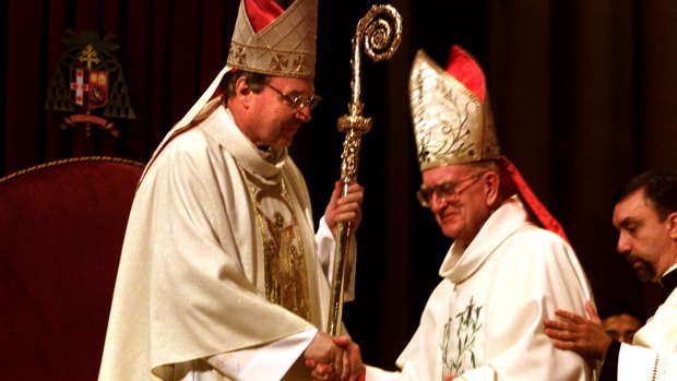 Archbishop George Pell receiving the staff from Cardinal Edward Clancy, his predecessor, in 2001.