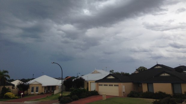 The sky above Perth's northern suburbs was dark with rain.