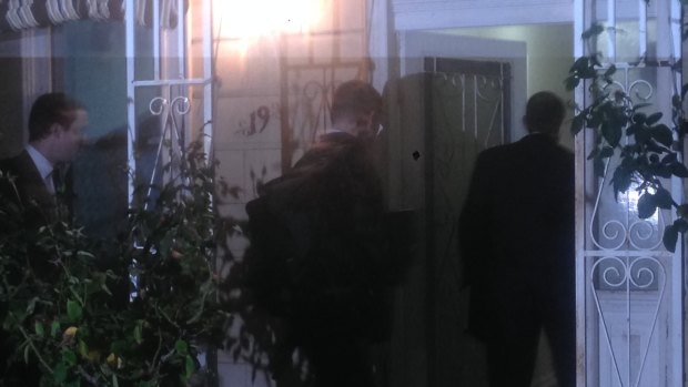 AFP agents raid a Labor staffer's house in Melbourne on May 19.