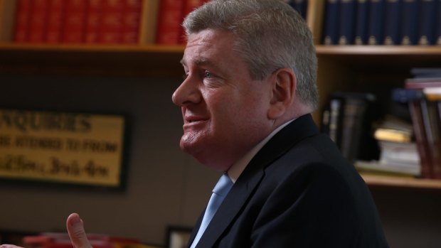Communications Minister Mitch Fifield has  pledged to look again at cross-media ownership restrictions.