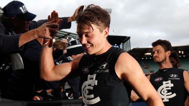 Young Blue Patrick Cripps enjoys the taste of victory.