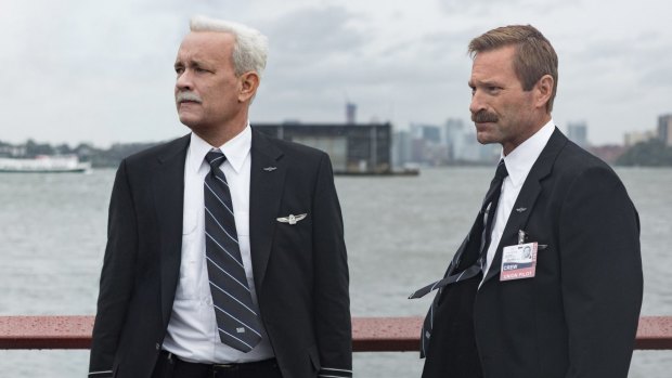 Tom Hanks as Chesley Sullenberger and Aaron Eckhart as Jeff Skiles in <i>Sully</i>.