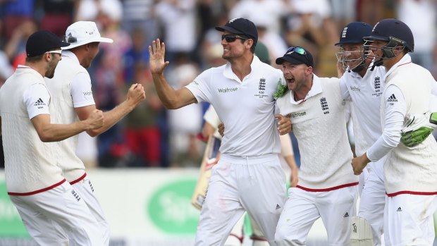 One-up:  Alastair Cook and his team celebrate the First Test win over Australia.