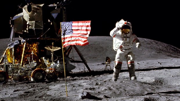 In this April 1972 photo made available by NASA, John Young salutes the US flag at the Descartes landing site on the moon during the first Apollo 16 extravehicular activity. 