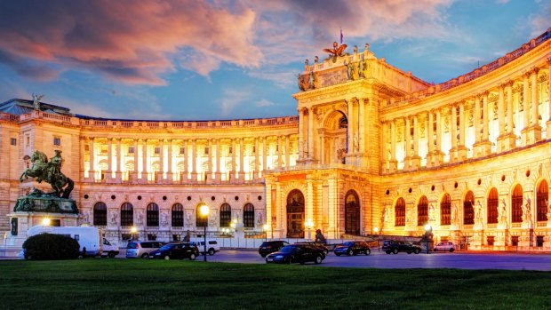 Hofburg palace at dusk, part of Historic entrance way to the Spanish Riding School.