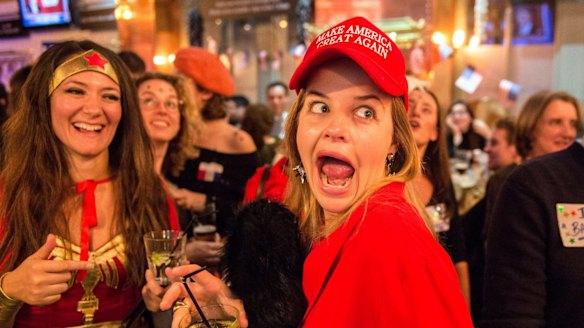 A Democrat wearing a 'Make America Great Again' hat and her friend dressed as Wonder Woman were celebating when Hillary Clinton won the state of Vermont.