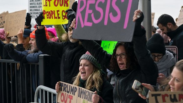 Protesters assemble at John F Kennedy International Airport in New York last week.