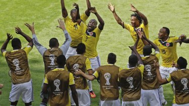 Colombian players celebrate their first goal.