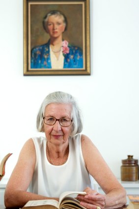 Fran Church below a portrait of her aunt Lynette Young.