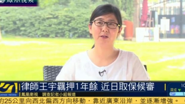 Human rights lawyer Wang Yu being interviewed on Hong Kong-based Phoenix TV after her release on bail. 