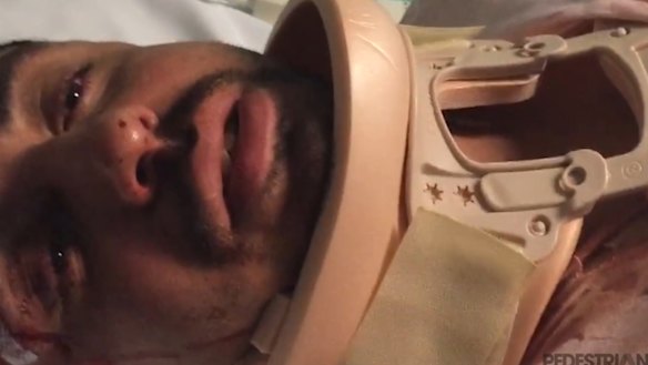 The injured man receiving treatment.