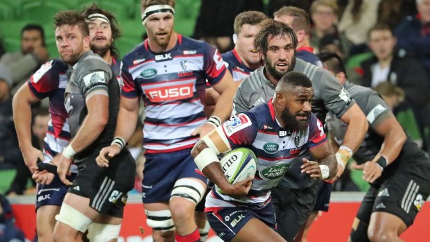 Marika Koroibete of the Rebels runs in to score a try against the Crusaders.