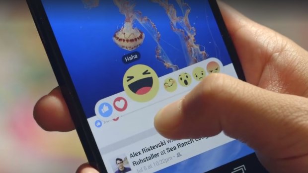 A beta version of Facebook's new emoticons showing the "yay" button, which has since been dropped.