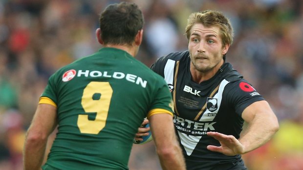 Redemption in black: Kieran Foran takes on Cameron Smith and the Kangaroos at Suncorp in 2015.