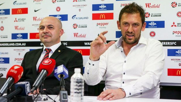 Devil's in the detail: Western Sydney Wanderers coach Tony Popovic announces his retirement with CEO John Tsatsimas at a press conference on Sunday.