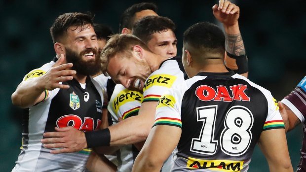 Strong finish: Bryce Cartwright is mobbed after scoring.