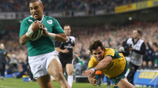 Flying start: Ireland winger Simon Zebo swoops on a kick to score the opening try.