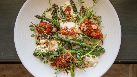 Stracciatella and grilled asparagus with romesco sauce at Union Dining.