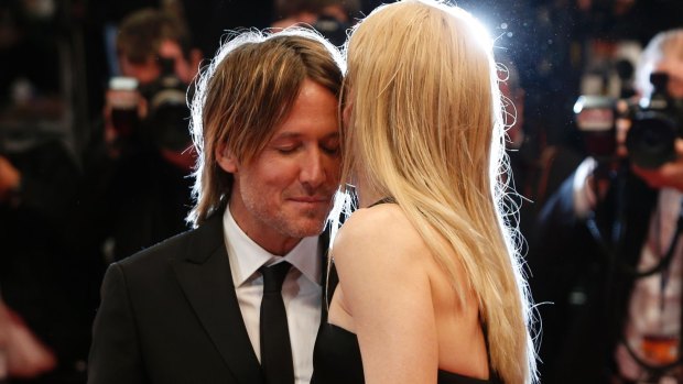 Nicole Kidman shares an intimate moment with her husband Keith Urban on the Cannes red carpet.