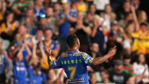 Home-town heroes: Parramatta's Chris Sandow celebrates his side's win over South Sydney. But the Eels must learn to win away from home - particularly at ANZ Stadium.