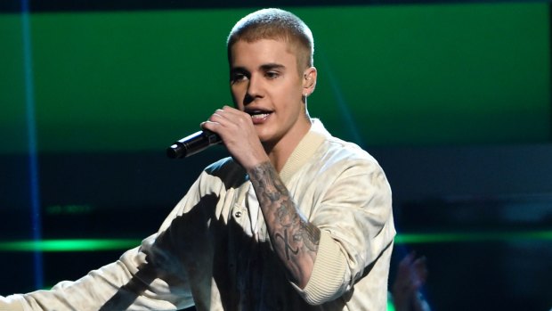 Taskforce Argos detectives have charged a 42-year-old man with more than 900 child sex offences after he allegedly posed as Justin Bieber to groom children.