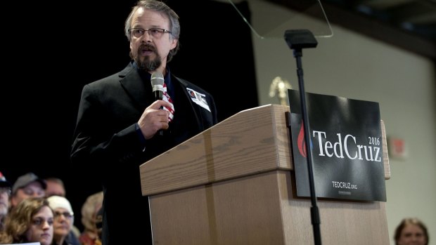 Coeur d'Alene pastor Tim Remington leads the prayer during the rally for Republican presidential hopeful Ted Cruz. He was shot  as he was leaving the Altar Church after Sunday services. 