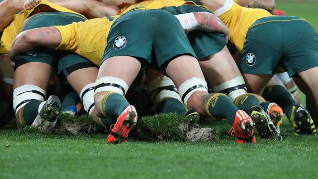 The pitch is churned up during a scrum during the Wallabies v England Test match.