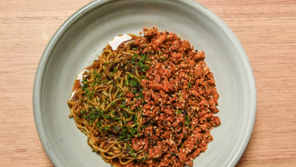 Coming in hot: XO noodles and spicy chicken skin at Sunda in Melbourne.