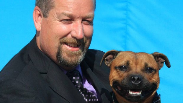 Patrick Walsh, president of the Staffordshire Bull Terrier Club of Victoria, with his dog Juno.