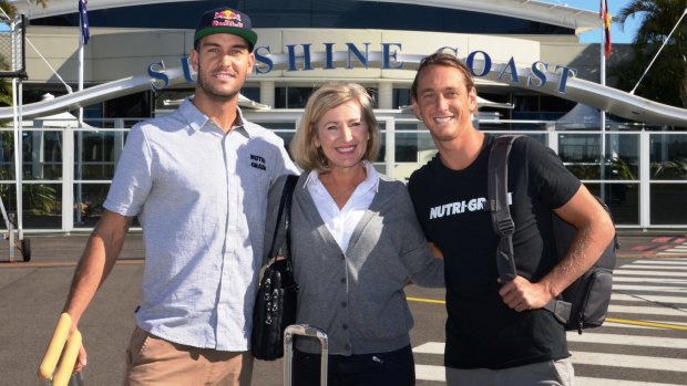 Ironmen Matt Poole and Ali Day (right) mark the Sunshine Coast's 'Fly Local' campaign with publisher Kim McCosker to boost Sunshine Coast Airport