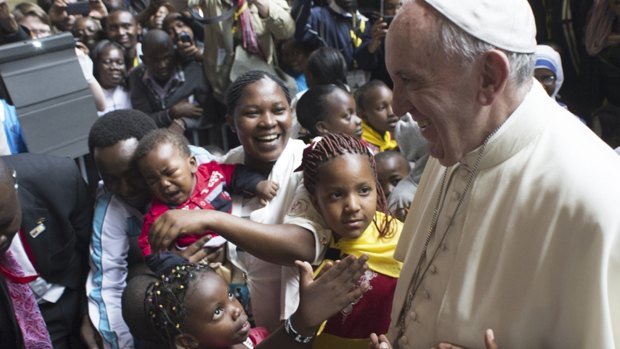 Pope Francis meets children during his visit to Kangemi, one of the 11 slums dotting Nairobi.