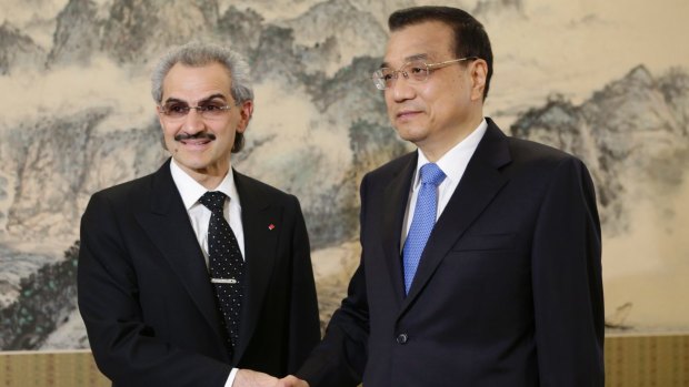 Saudi Prince Alwaleed bin Talal, left, shakes hands with China's Premier Li Keqiang. The prince was once of 11 arrested along with ten former ministers.