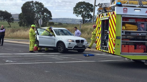 Firefighters on scene at a car crash at Fyshwick on Monday morning.