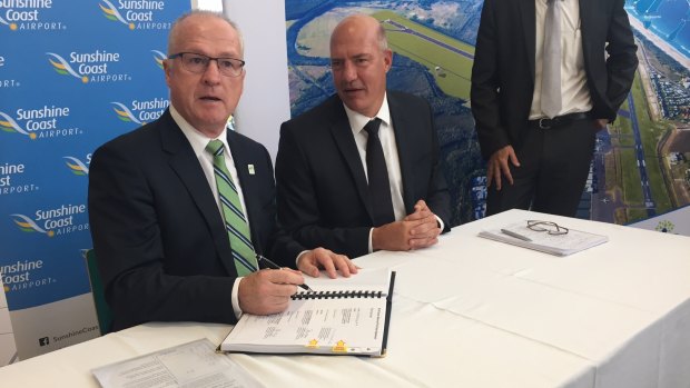 Sunshine Coast mayor Mark Jamieson signs the agreement for developer Palisade to operate the airport.