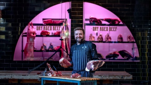 Butcher and chef Ryan Crawford at Argyle Smokehouse & Butchery carves prime rib.