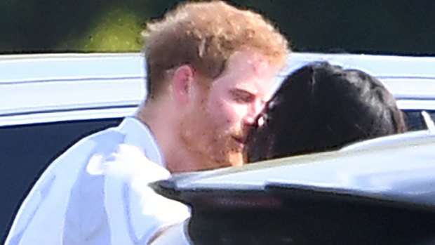 Meghan Markle and Prince Harry kiss and hug after Harry played in the Audi Polo Challenge earlier this month.